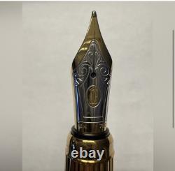 Stylo à plume CARTIER noir et or 18 carats - État neuf