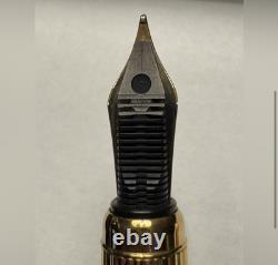 Stylo à plume CARTIER noir et or 18 carats - État neuf