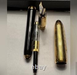 Stylo à plume CARTIER noir et or 18 carats - État neuf